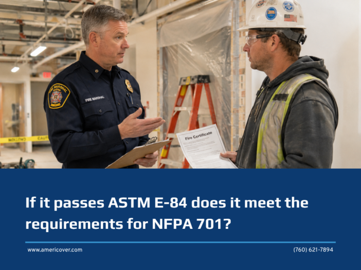 Contractor holding a fire certificate asks a fire marshal whether passing ASTM E84 does meet NFPA 701, beside a plastic sheeting dust barrier