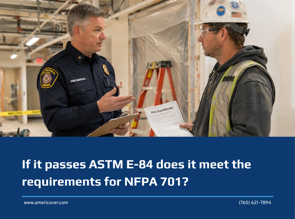 Contractor holding a fire certificate asks a fire marshal whether passing ASTM E84 does meet NFPA 701, beside a plastic sheeting dust barrier