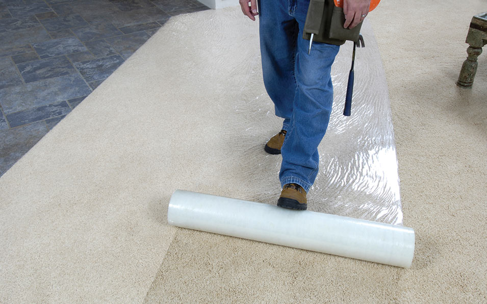 Self-adhesive film for temporary carpet cover