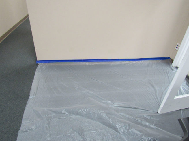 Pre-taped poly sheeting on carpet